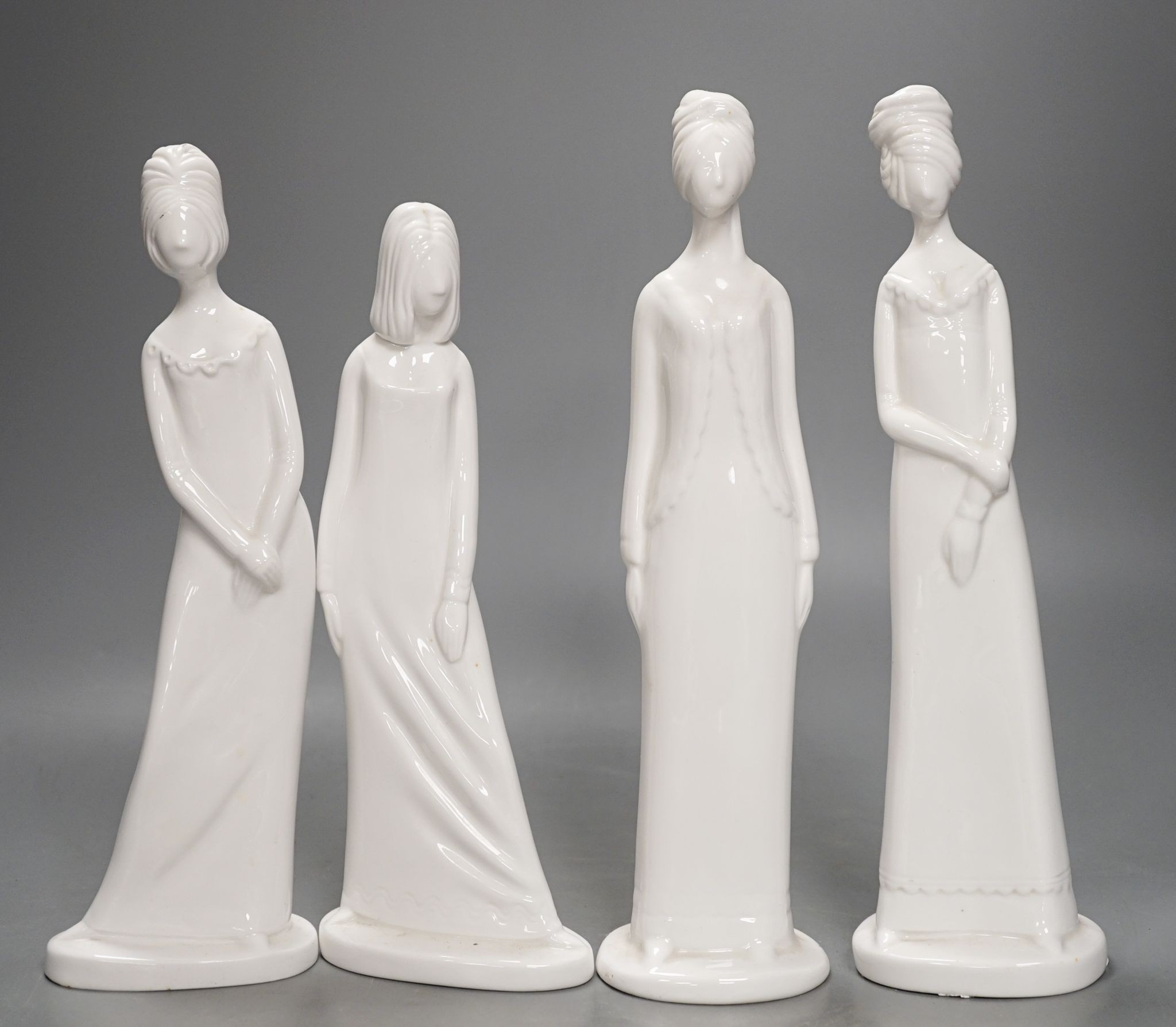 Eight Spode white glazed porcelain figures of elegant ladies by Pauline Shone 27cm